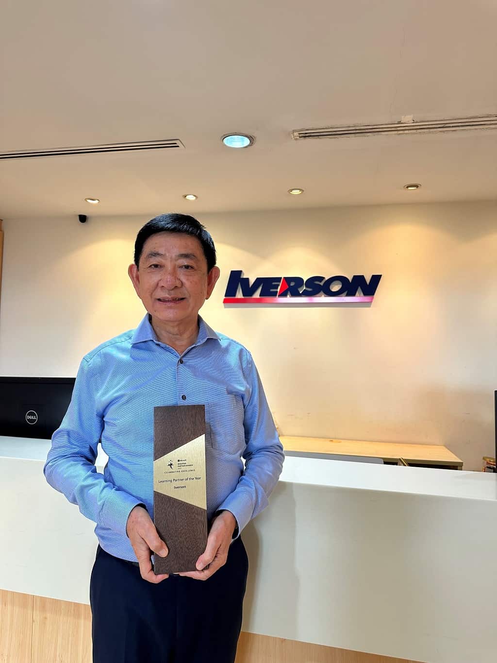 Iverson Managing Director, Dr Yap Chee Sing with the trophy of Microsoft Learning Partner of the Year 2022