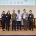 Alex (third to the right) and Ken (second to the right) receive the Green Pioneer Recognition Awards from Synergy Esco and LPHS representatives, celebrating their green leadership and sustainability.
